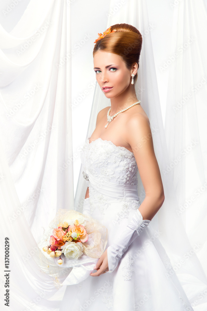 Young, beautiful and emotional bride with a beautiful flowers Young, beautiful and emotional bride with a beautiful flowers