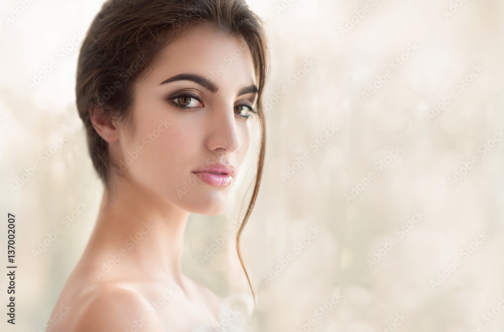 Beauty model with make up and fresh skin is posing front of the Beauty model with make up and fresh skin is posing front of the