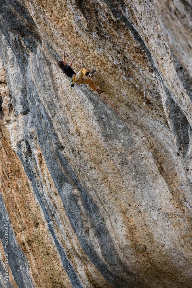 Outdoor activity. Extreme rock climbing lifestyle. Male rock climber on a cliff wall. Siurana, Spain. Outdoor activity. Extreme rock climbing lifestyle. Male rock climber on a cliff wall. Siurana, Spain.