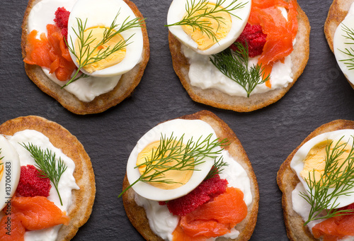 Obraz na plátně Russian buckwheat pancakes blini with cream and caviar