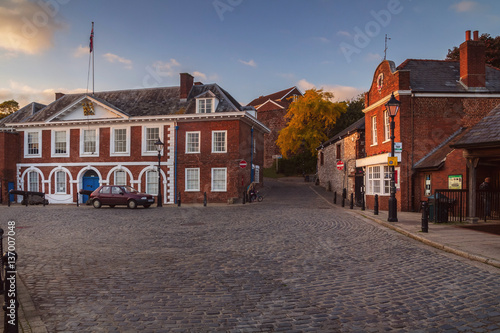Customs House in Exeter. Evening light. Nobody. The car on the paved area.
