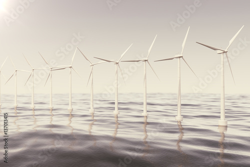 Offshore wind farm turbines caught in sunset sky. Beautiful contrast with the blue sea. ecological concept. 3d rendering