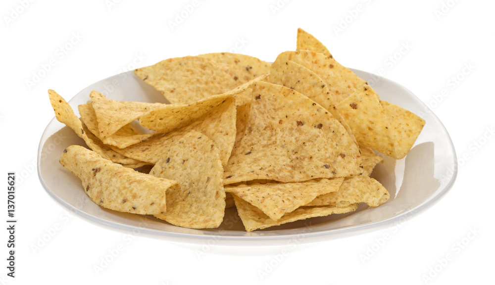 Plate with a serving of tortilla chips isolated on a white background. Plate with a serving of tortilla chips isolated on a white background.