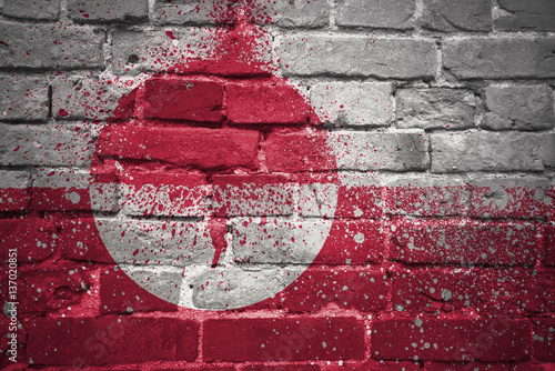 painted national flag of greenland on a brick wall photo