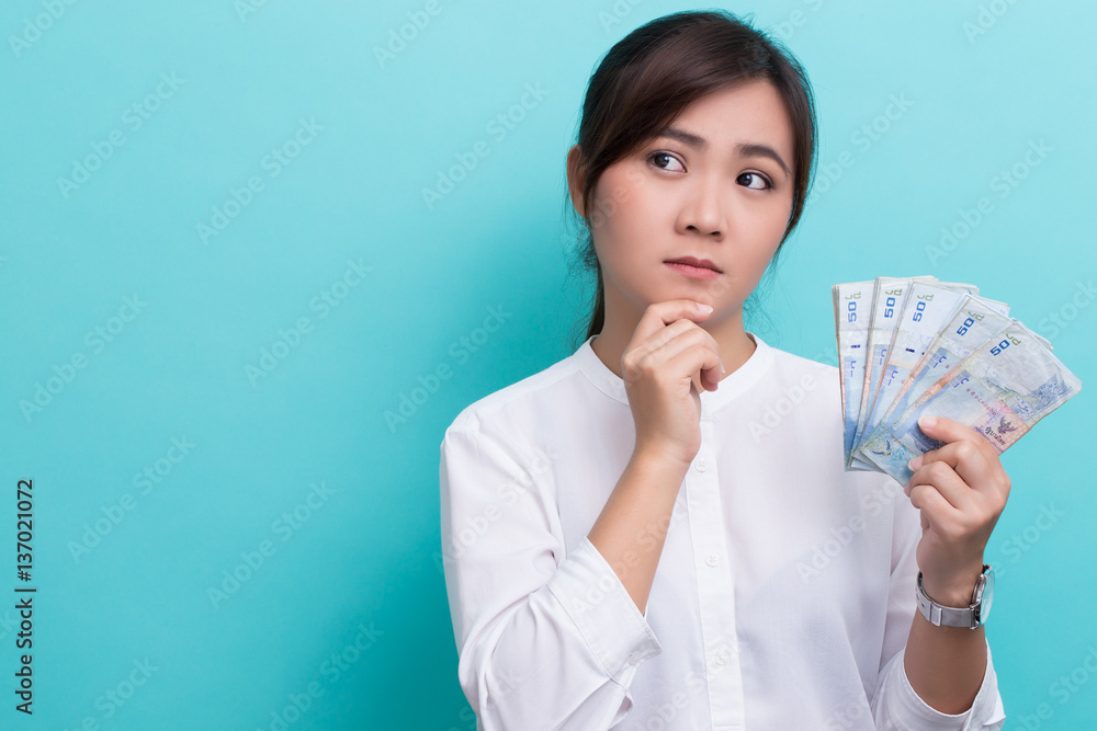 Asian woman planing to use fifty baht banknote Asian woman planing to use fifty baht banknote