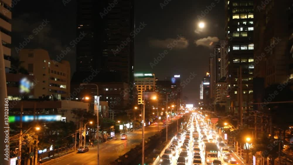 Moon rise above busy traffic in Bangkok, Thailand Moon rise above busy traffic in Bangkok, Thailand