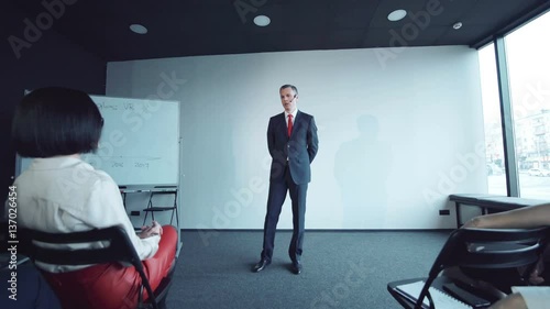 Woman expressing boredom and anger during the presentation.