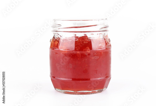 fresh strawberry jam in glass bottle with mint leaf