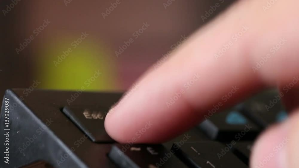man presses the black button enter. Macro shooting man presses the black button enter. Macro shooting