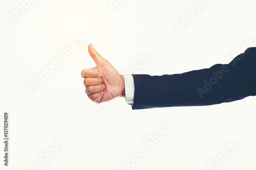 Successful thumbs up after good deal. businessman thumbs up