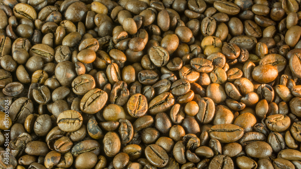 Fresh roasted coffee beans for a background Fresh roasted coffee beans for a background
