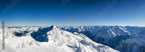Sunny panoramic view of Austrian Alps from viewpoint of ski resort Zillertal Hintertuxer Glacier, Tirol, Austria. © Neonyn