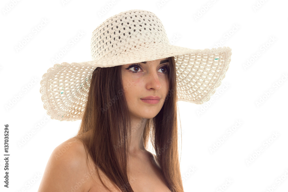 close up portrait of young beautiful brunette girl in straw hat with wide brim posing isolated on white background close up portrait of young beautiful brunette girl in straw hat with wide brim posing isolated on white background
