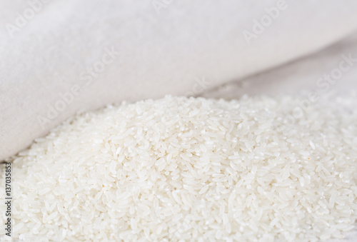 Rice grains closeup on a white background.