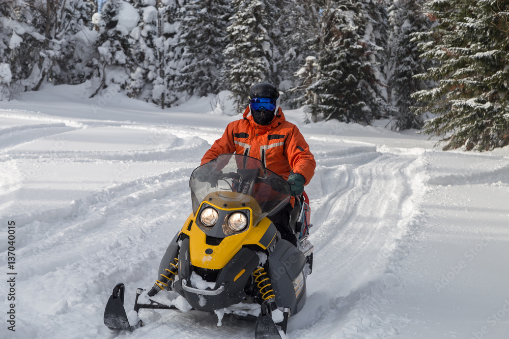 Athlete on a snowmobile