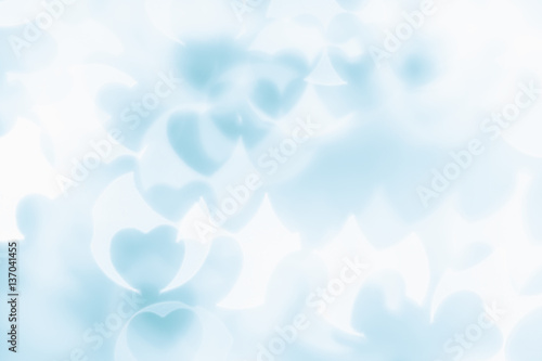  Valentine's day abstract background of soft blue, white bokeh blur hearts. Festive valentine backdrop.