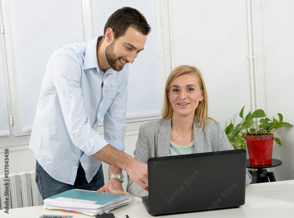 attractive man and woman business using laptop computer