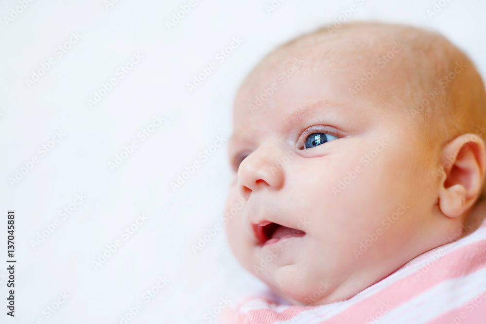 Close up of baby face isolated on white background.