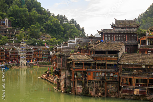 Photo of Historic Asian Village. Wooden Houses Above the Water. Trasitional Chinese Architecture Wood Buildings