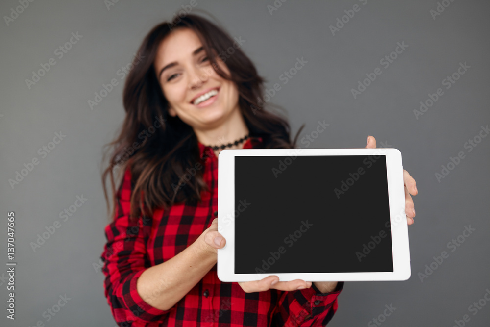 Casual happy Woman Showing Digital Tablet With Blank Screen Casual happy Woman Showing Digital Tablet With Blank Screen