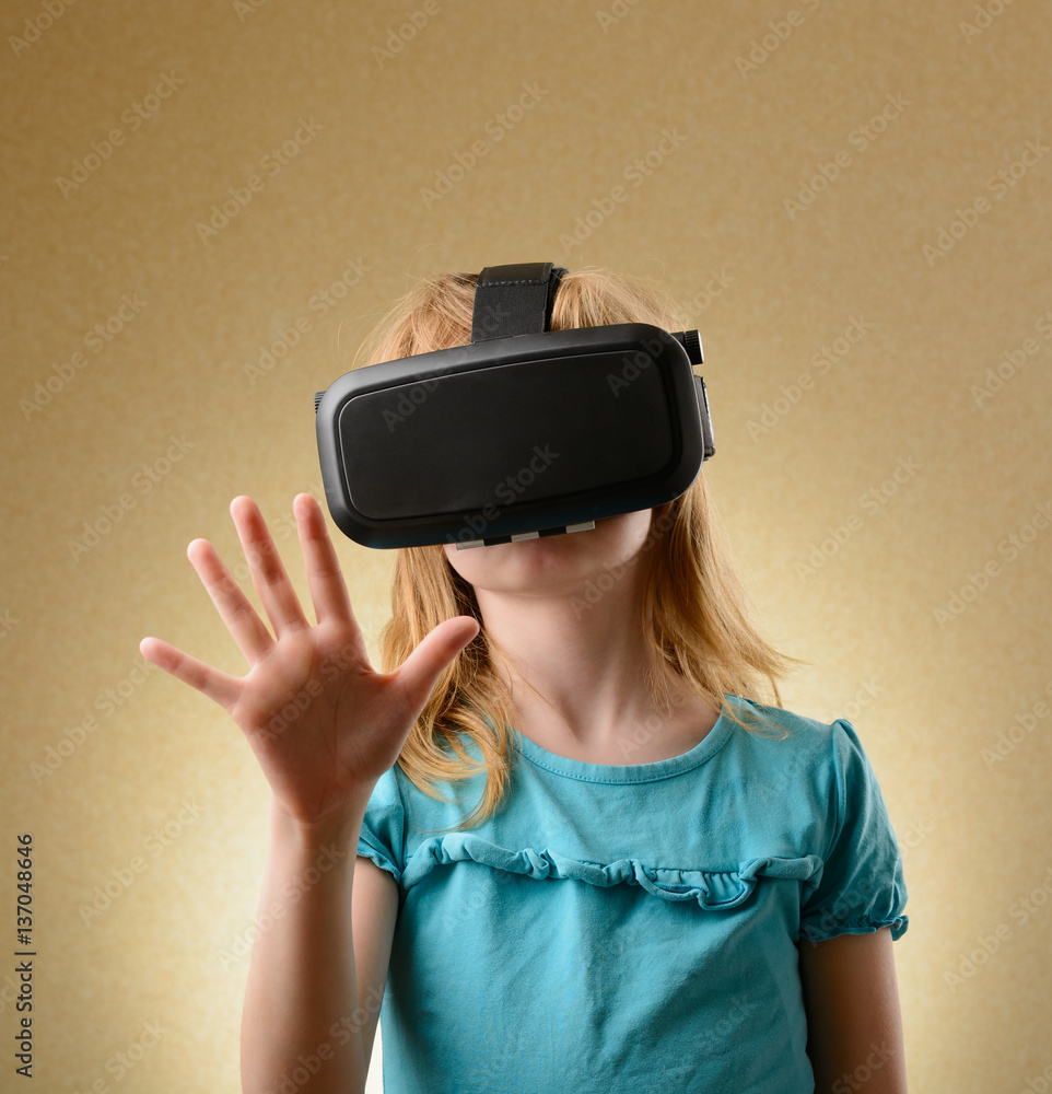 Little girl in virtual goggles Little girl in virtual goggles