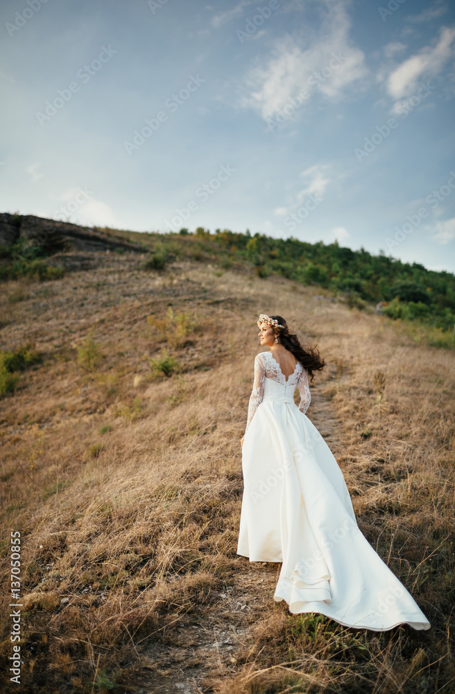Bride is on the hillside