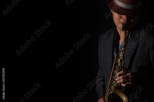 Photography A saxophone player in a dark background