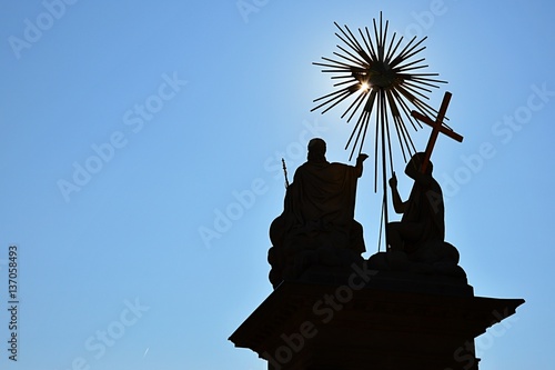 Silhouette of God the Father, Jesus Christ and Holy Spirit on The Holy Trinity column in Nova Bana, Slovakia photo