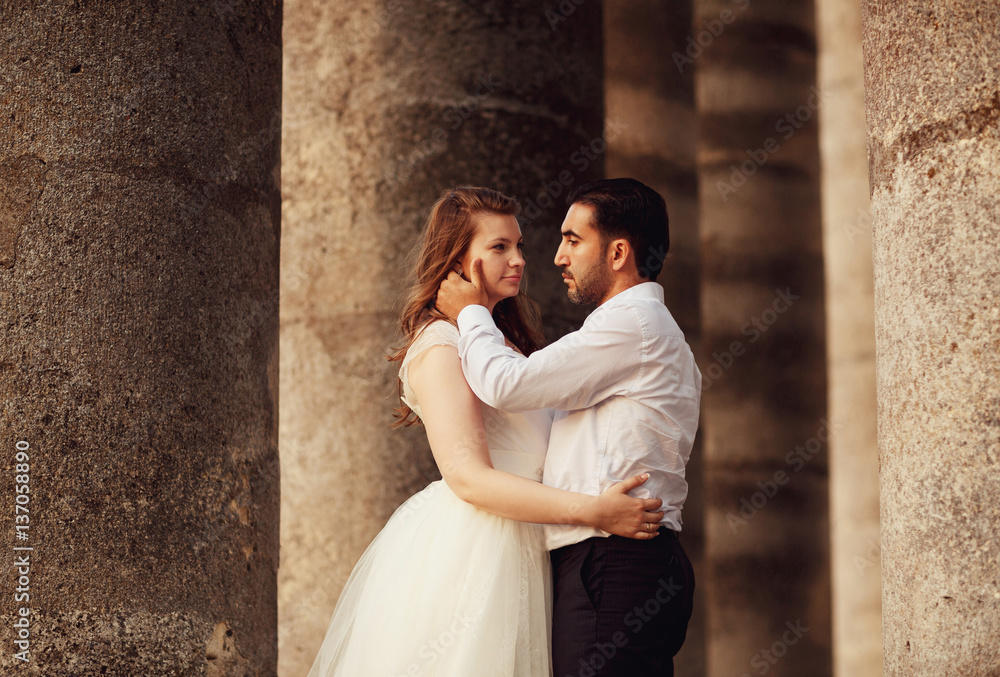 The brides standing near coloums