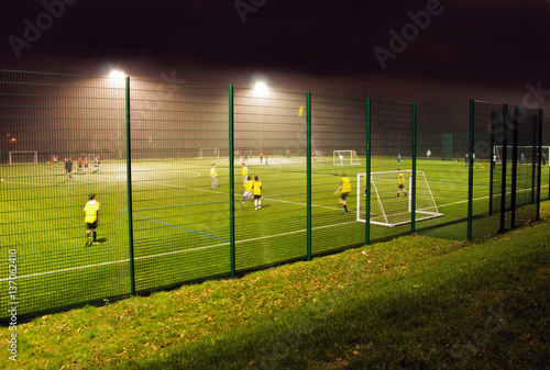 Night football training on an Astroturf facility photo