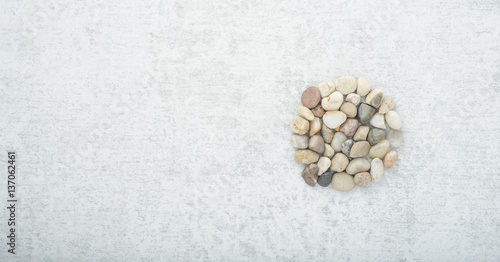Stones on stone background, concept of harmony and tranquility. Decoration with stone pebbles as natural design backdrop with copy space.