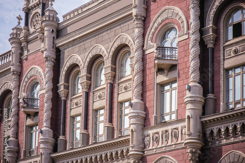 ancient architectural high rise building with windows and pillars photo