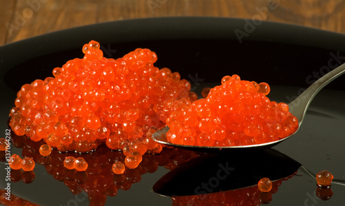 Isolated image of red caviar on a white background close up