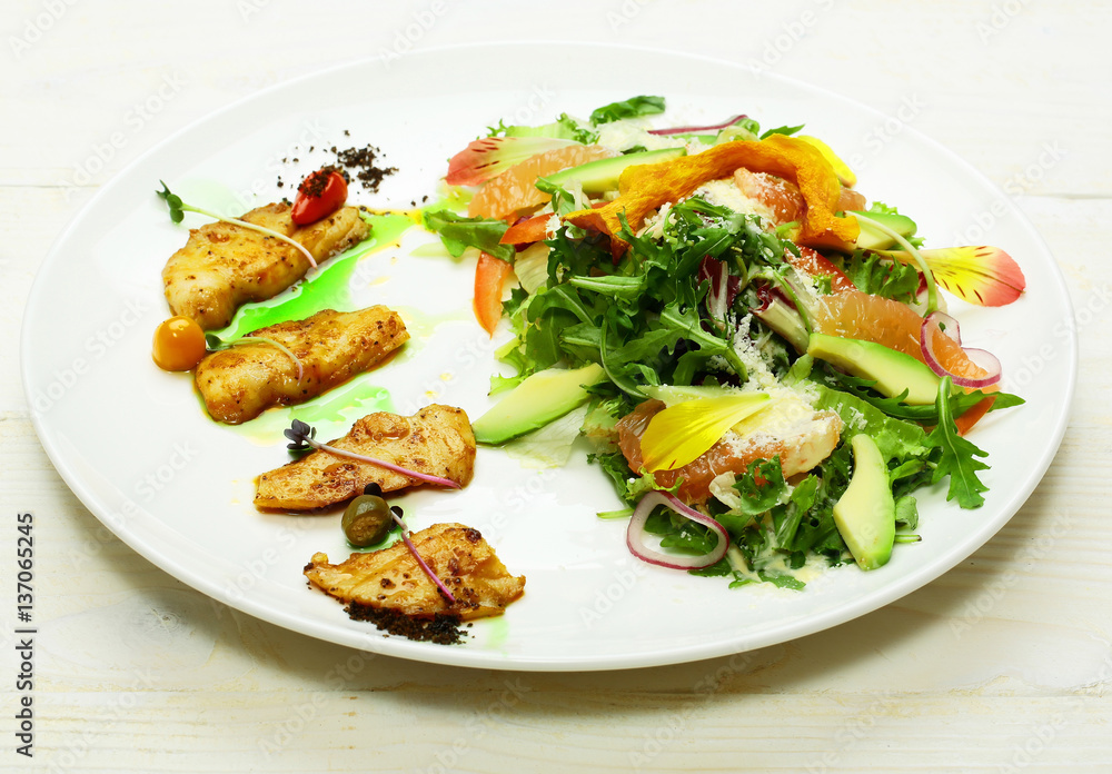 Fried fish and green salad Fried fish and green salad