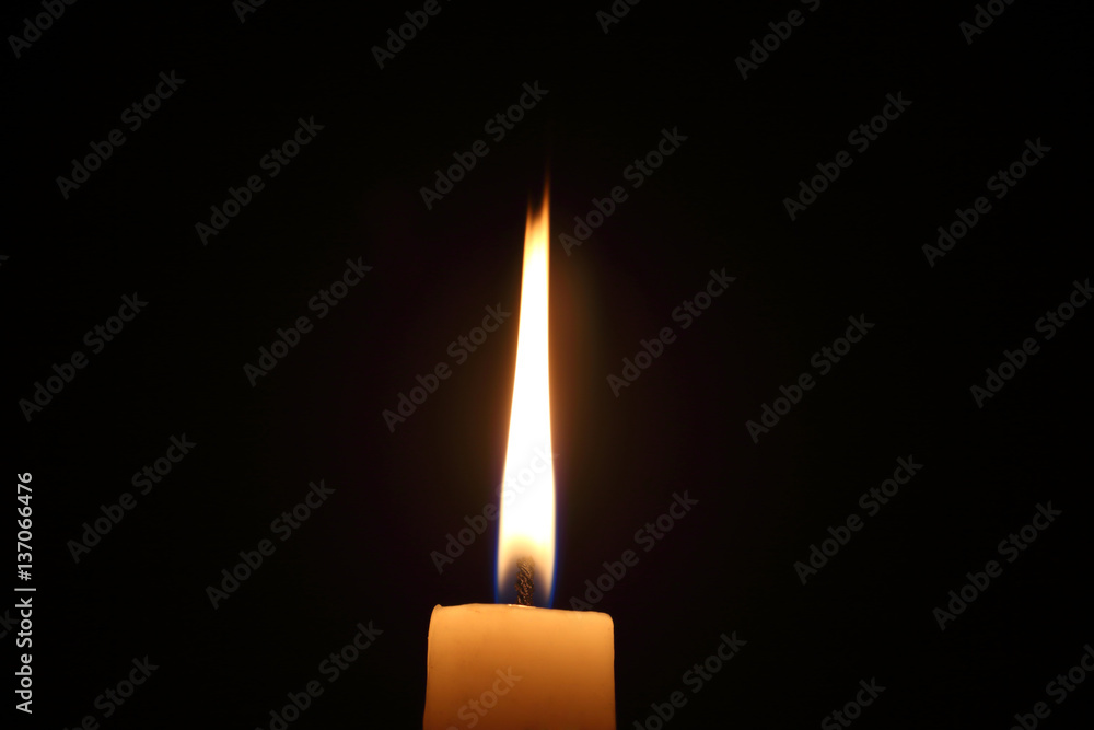 Lighting candles on a black background. Lighting candles on a black background.