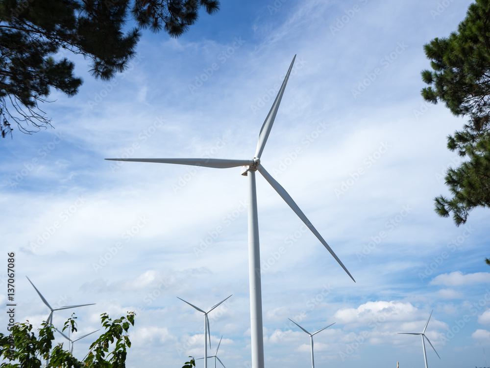Windturbine on the mountain, sky background Windturbine on the mountain, sky background