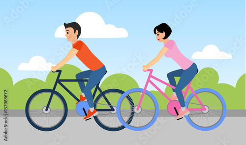 Couple of man and woman are riding a bicycle outdoors