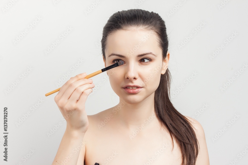 woman looking at those for make-up woman looking at those for make-up