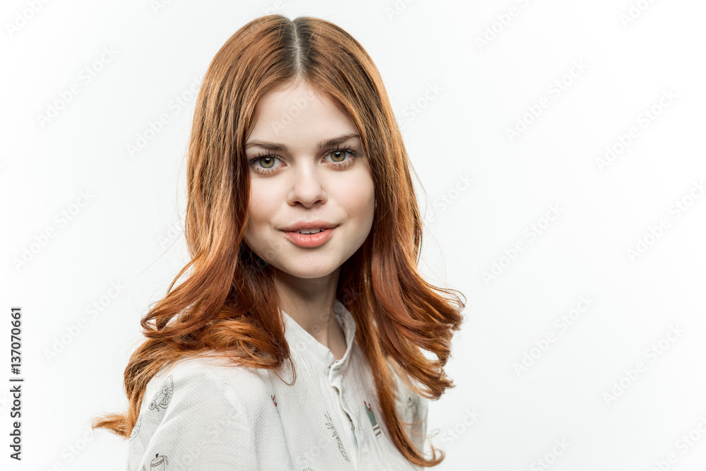 red-haired woman in a light shirt