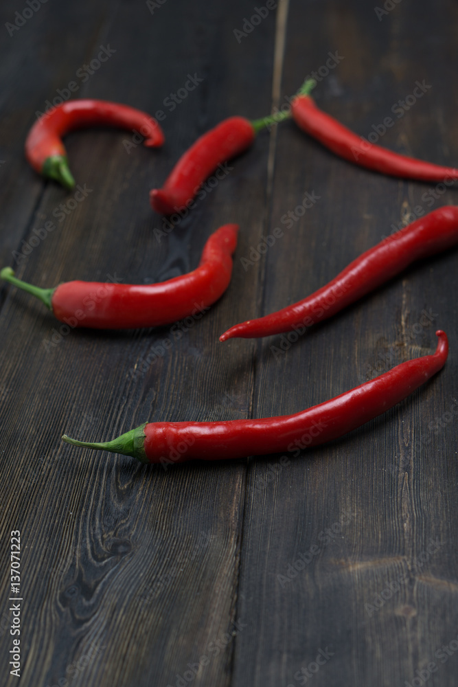 red pepper on a wooden background