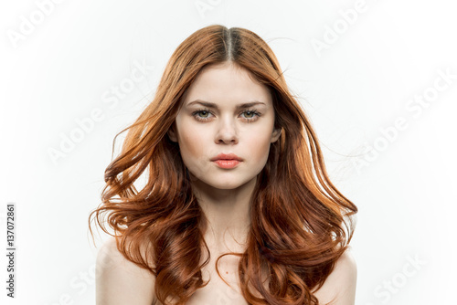 red-haired woman on a light background