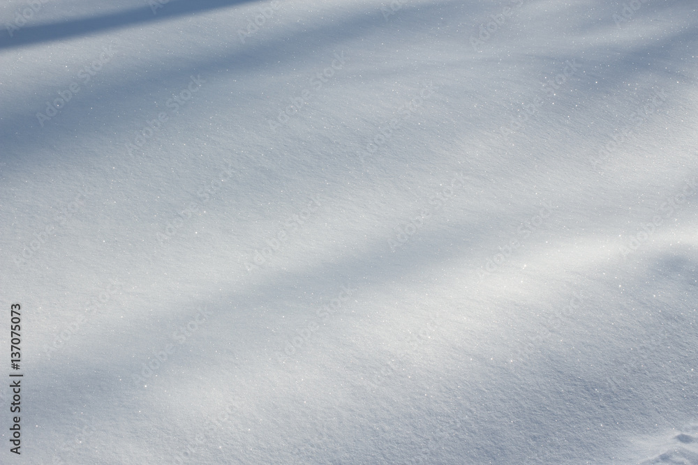 Fresh snow texture with natural shadows on winter ground. Horizontal color image of beautiful white nature background of snowy clean surface. Fresh snow texture with natural shadows on winter ground. Horizontal color image of beautiful white nature background of snowy clean surface.