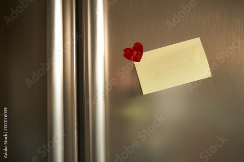  Love note with heart to your love on the refrigerator door with morning light  