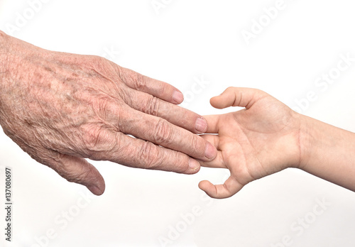Hands of  old man and child © zdravinjo
