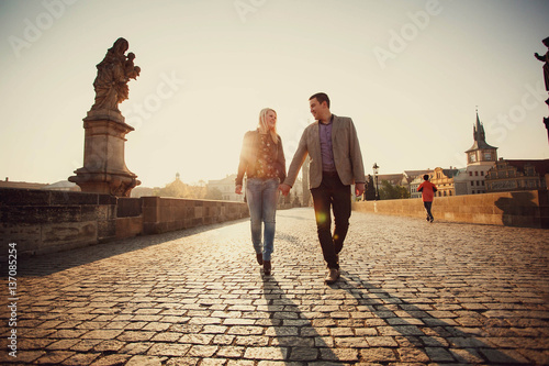 young and happy woman and man walking outdoors