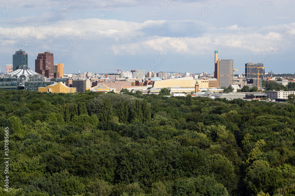 Cityscape of Berlin and road in Tiergarten park landscape in cloudy day