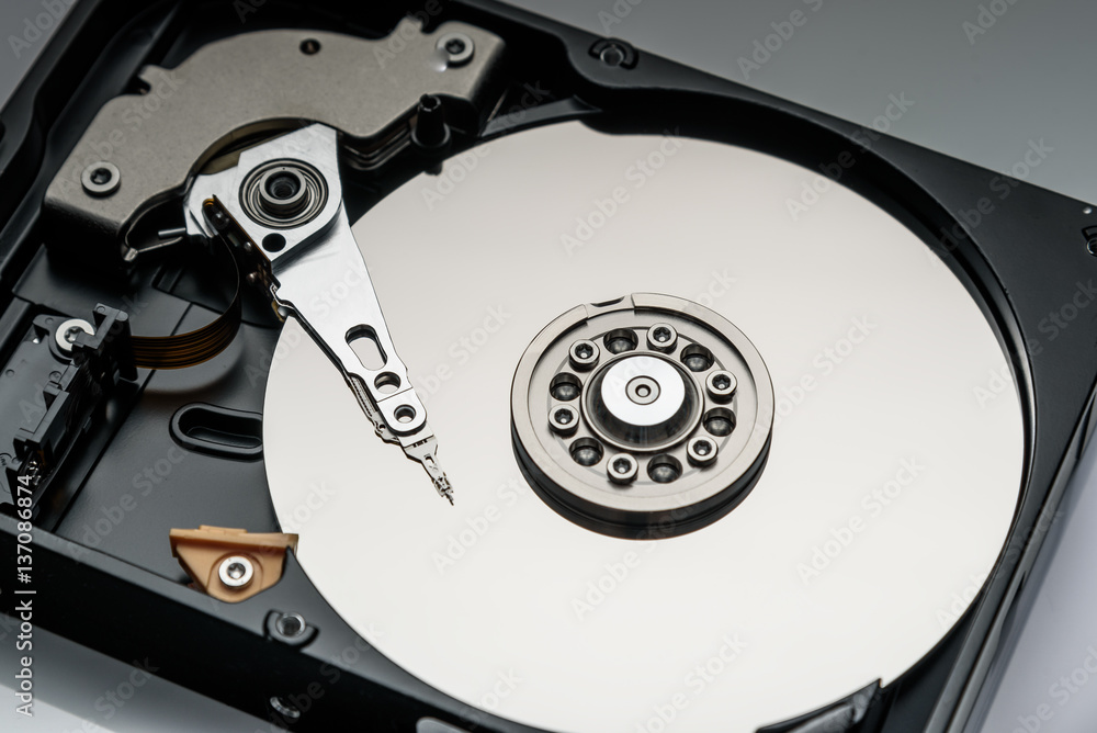 disassembled computer hard drive silver color closeup isolated disassembled computer hard drive silver color closeup isolated