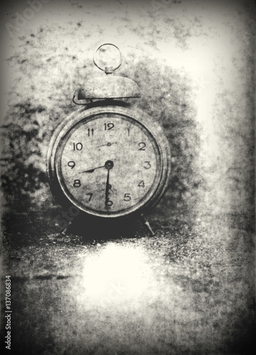 Old photo of the alarm clock - grained, scratched, overexposure and underexposure, overall poor and non commercial