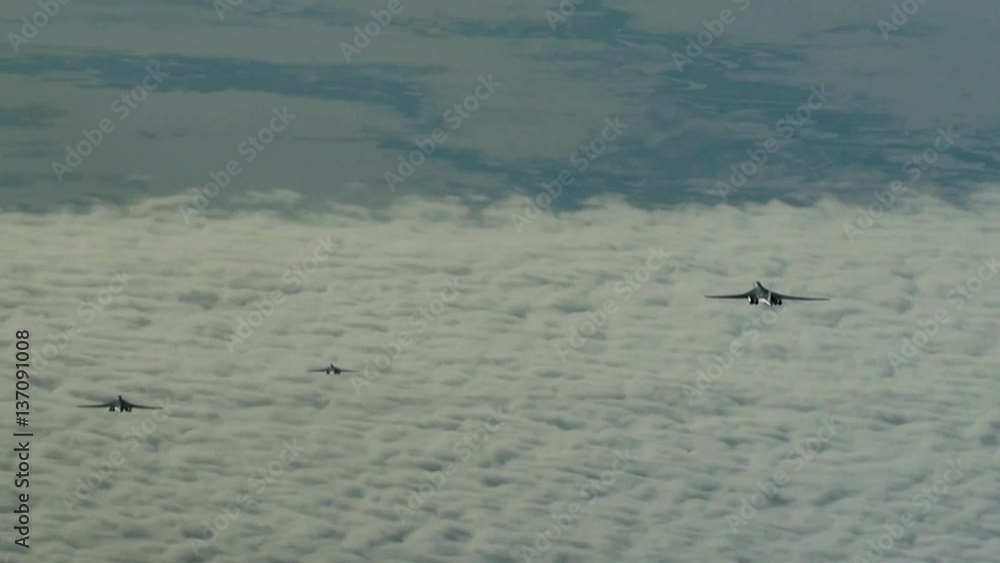 Three of the aircraft flying above the clouds Three of the aircraft flying above the clouds