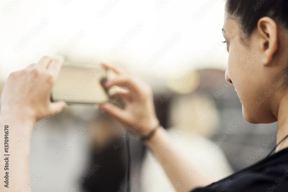 Cropped image of woman photographing from mobile phone Cropped image of woman photographing from mobile phone